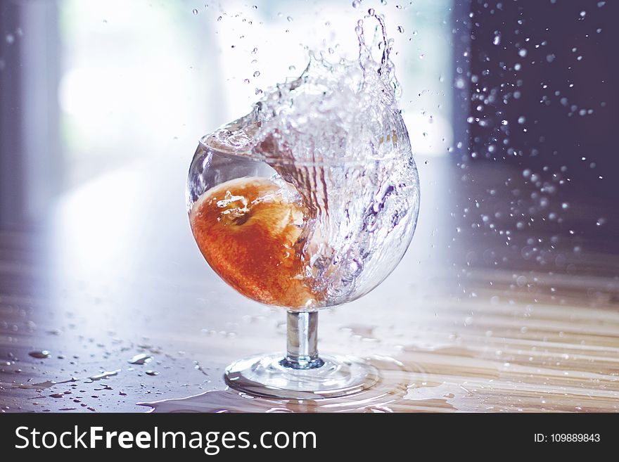 Close-up Of Water Splashing In Glass