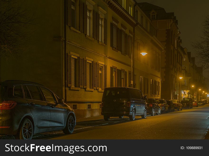 Cars in Illuminated City at Night