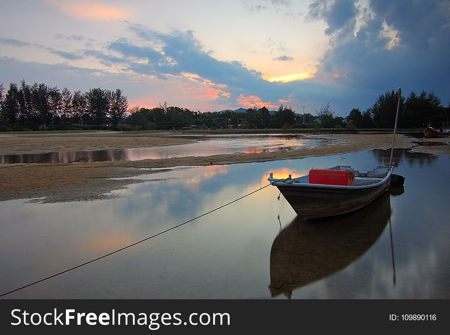 Scenic View Of Lake Against Sky At Sunset