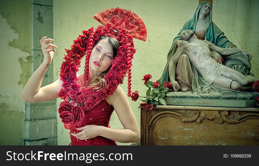 Midsection of Woman Wearing Red Flower