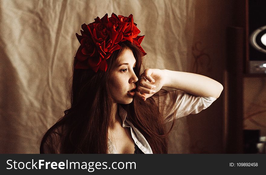 Photography of a Woman Wearing Red Flower Headdress