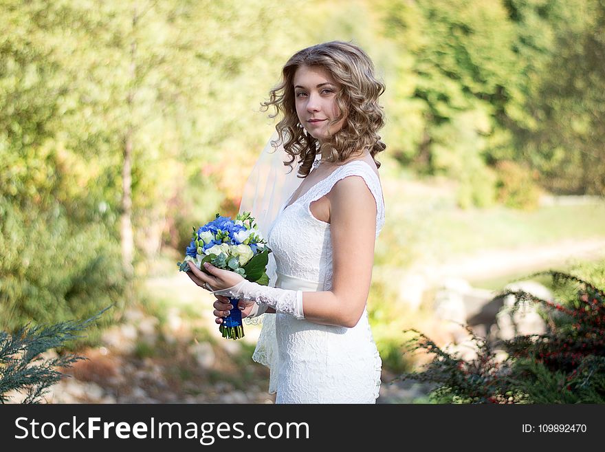 Portrait of a Beautiful Woman Holding Flower