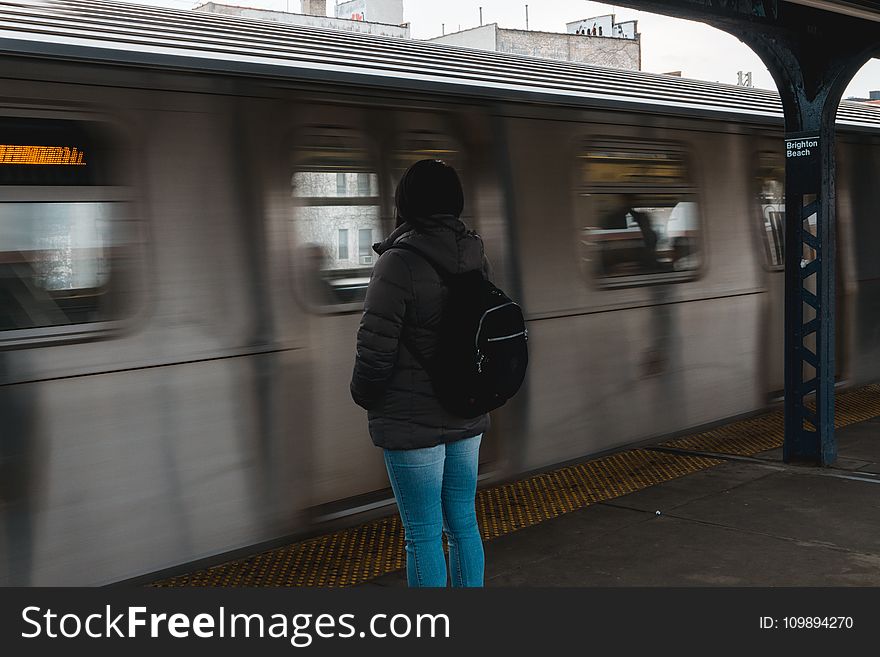 Photo of Woman Waiting at the Train Station