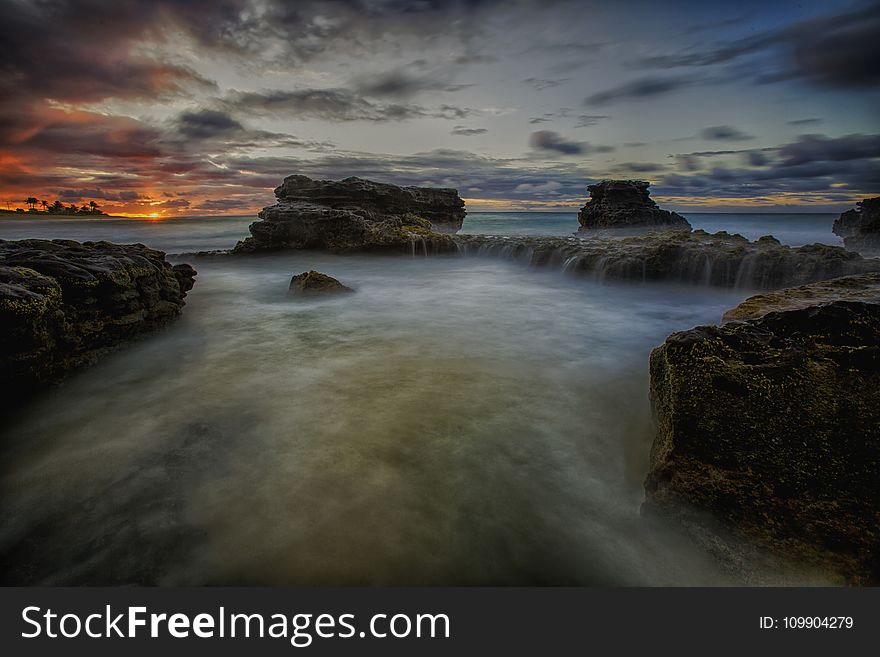 Scenic View of Ocean During Sunset