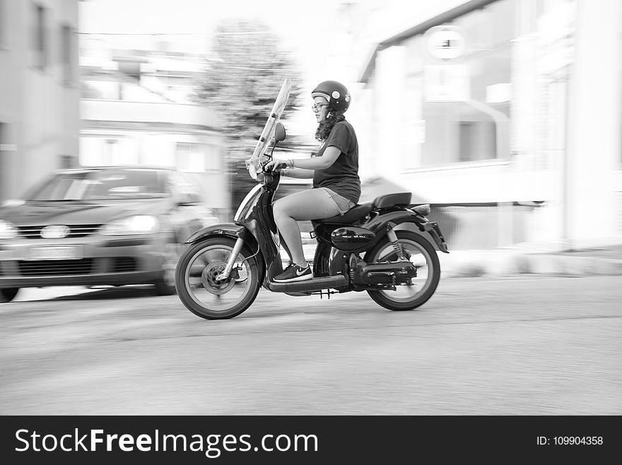 Woman Riding on Scooter Motorcycle