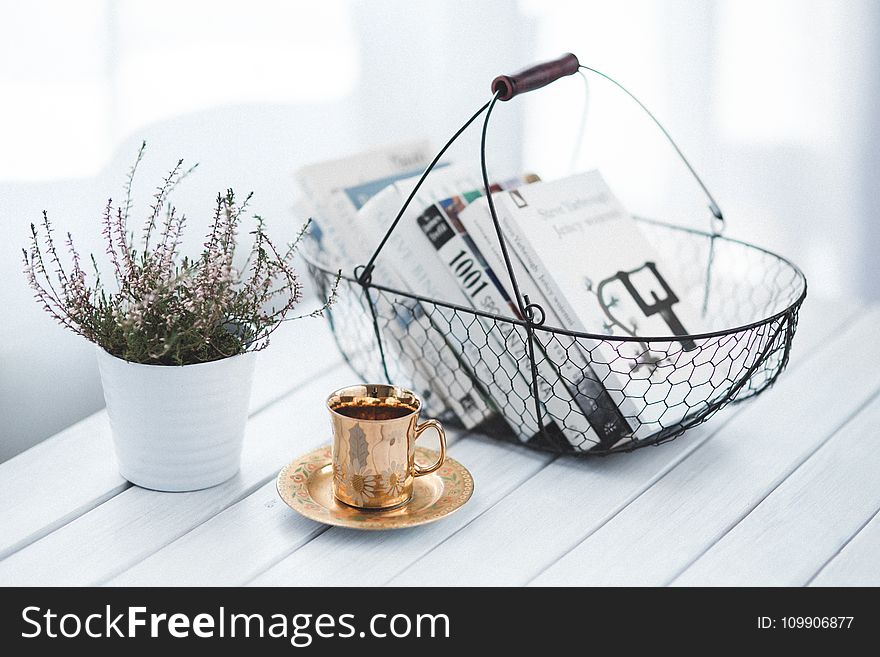 Golden Cup And Basket With Books