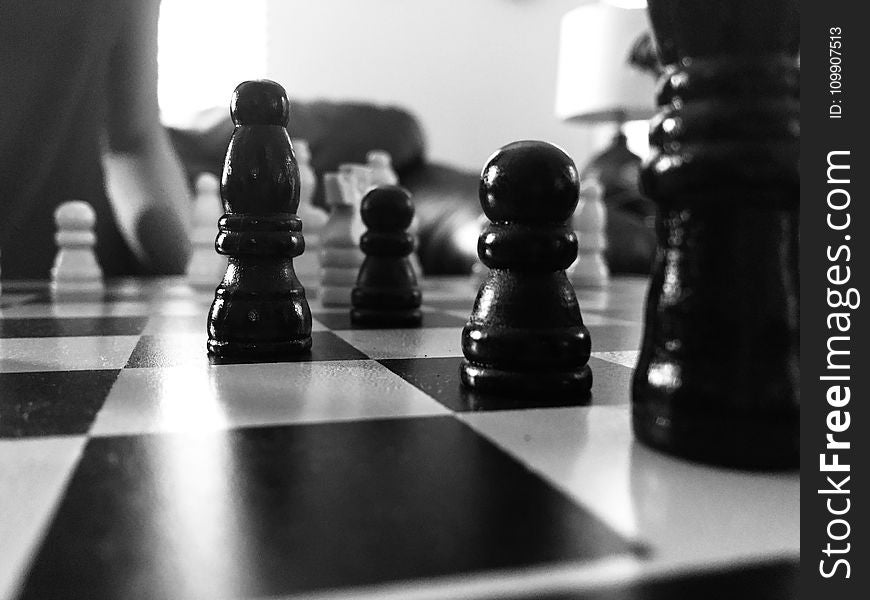 Grayscale Photography Of Chess Board