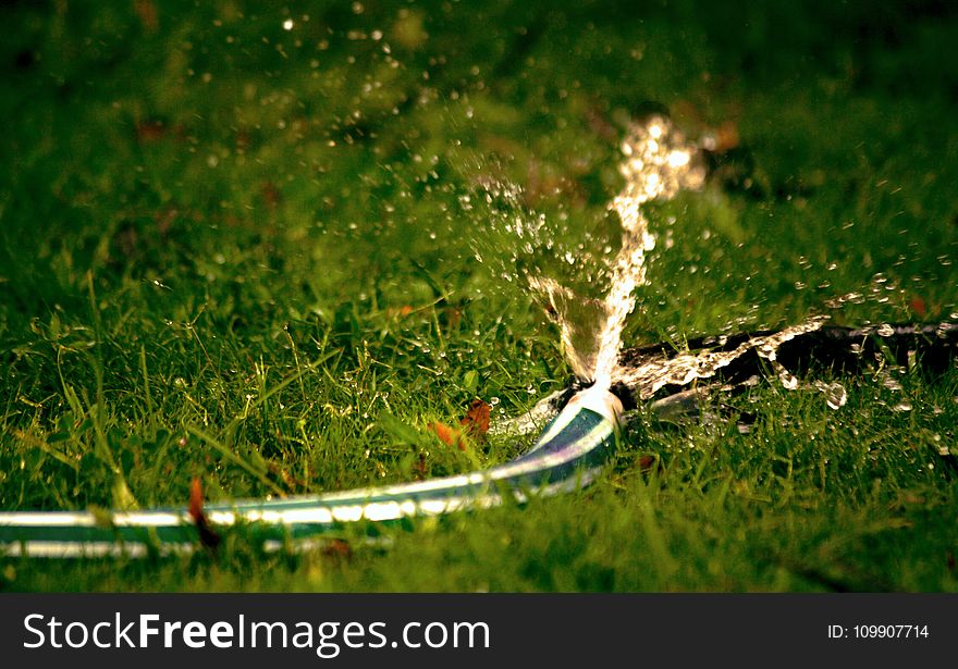 Close-Up Photography of Water Bursting Out of Hose