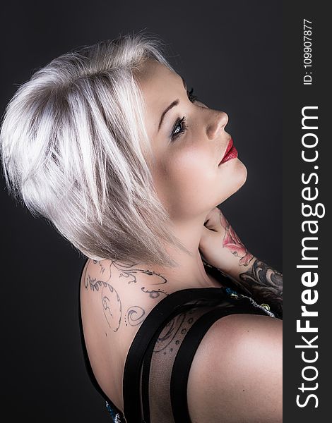 Woman Wearing Black Shirt With Tattoo and Red Lipstick