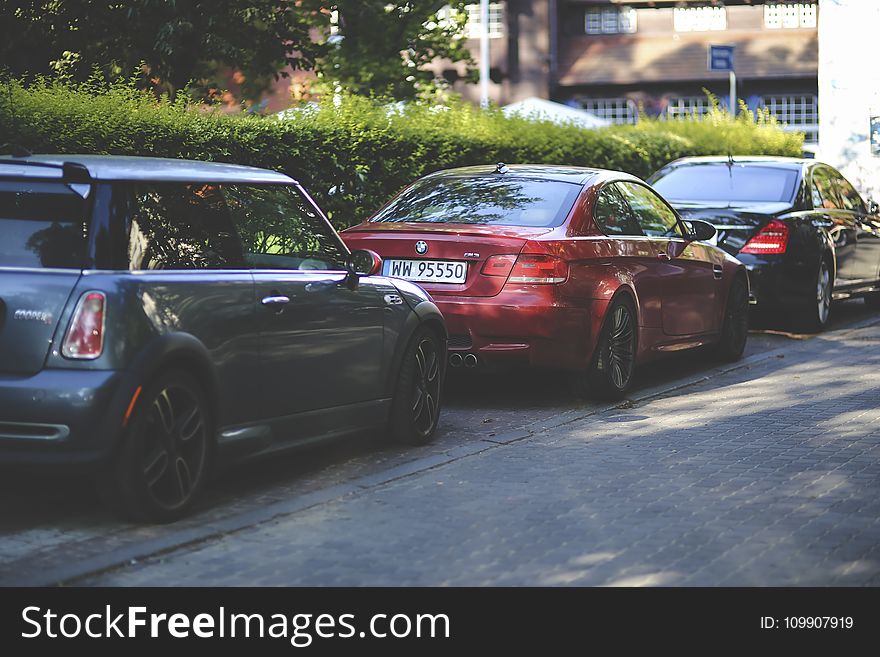 Cars parked along way