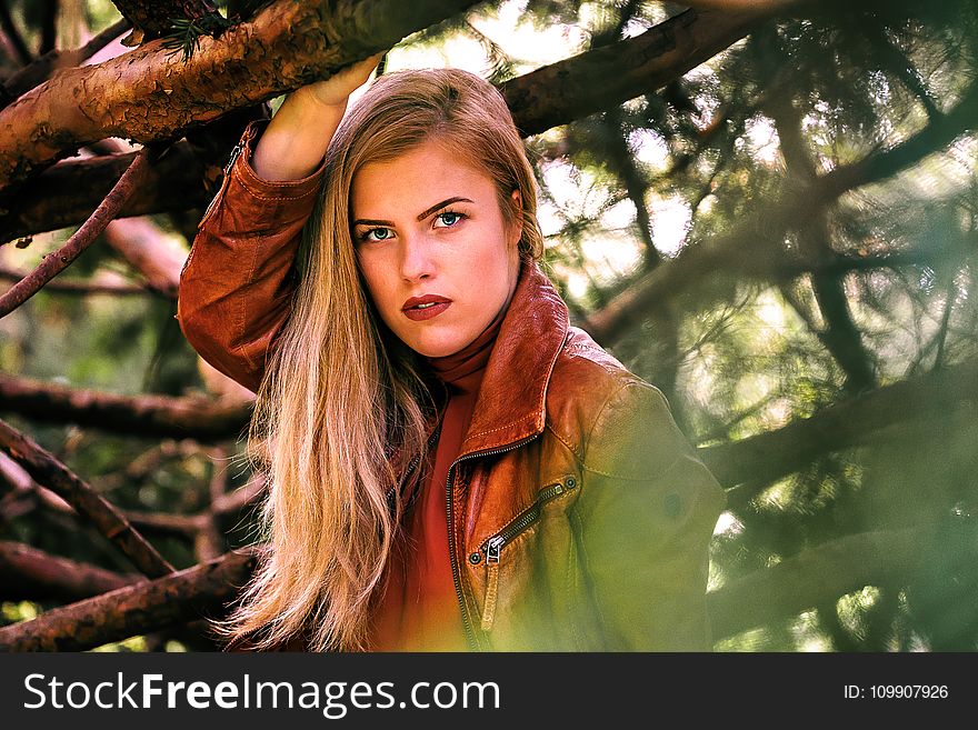 Woman Wearing Brown Leather Zippered Jacket