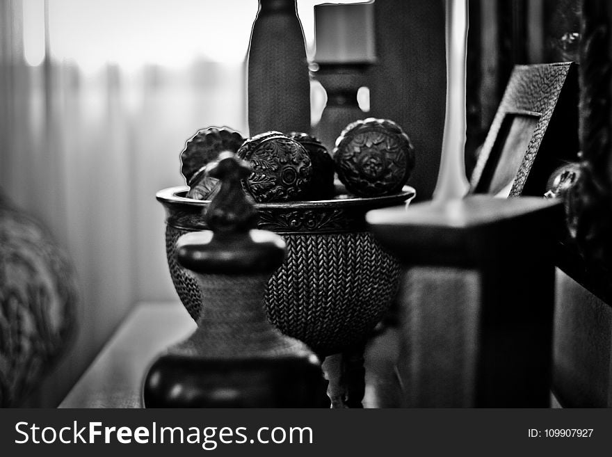 Grayscale Photography of Home Decorations Near Window