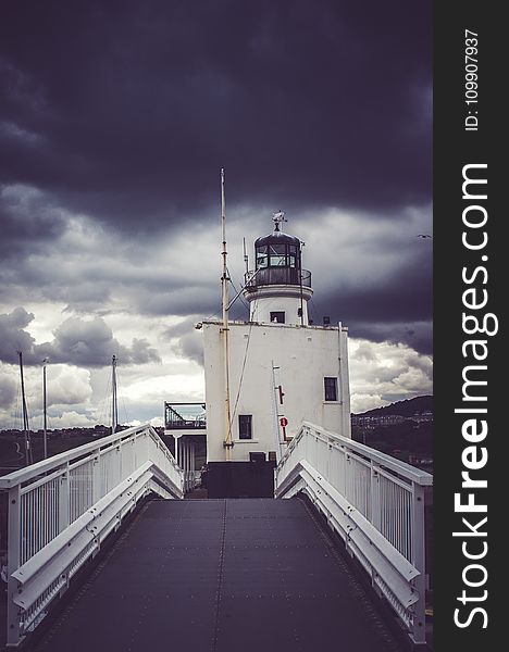 View of Cloudy Skies on Lighthouse