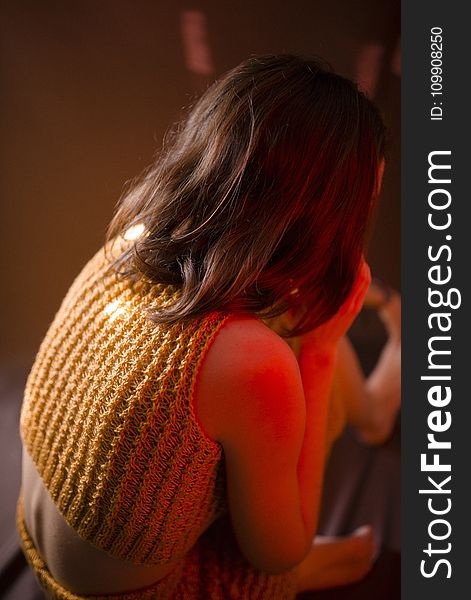 Woman Wearing Yellow Knitted Crop-top Shirt Sitting On Floor