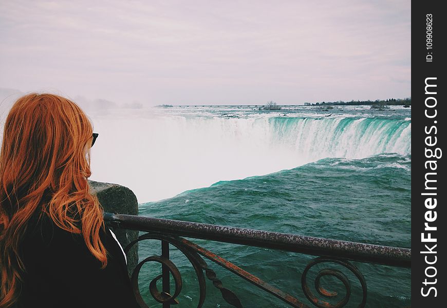 Woman Standing Near of Niagara Falls