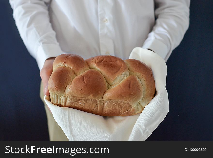 Brown Bread Held by a Person