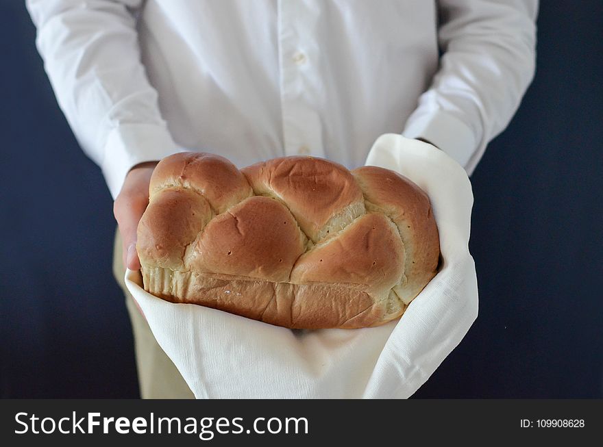 Brown Bread Held By A Person