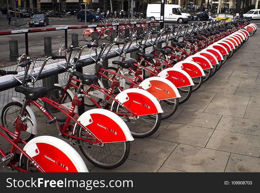 Parked Red and White Bicycles
