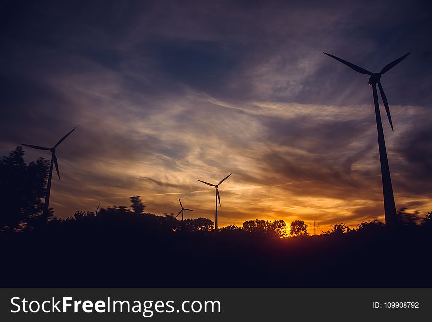 Black Windmills during Sunset