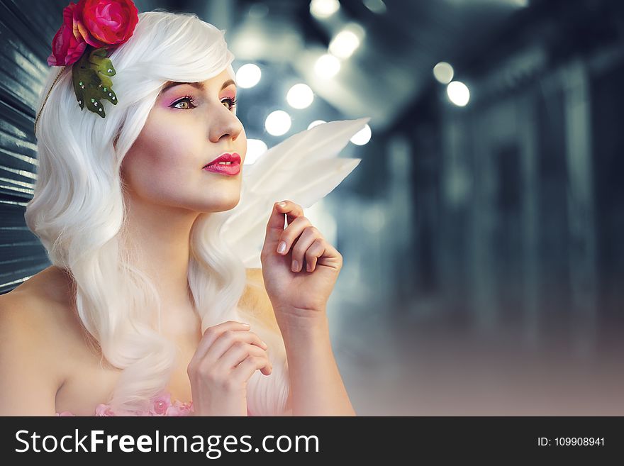 Tilt Lens Photography of Woman With Flower Headband
