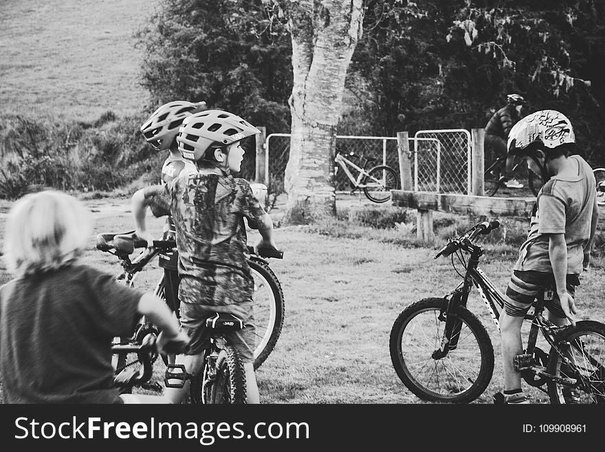 Grayscale Photography of Children Riding Bicycles