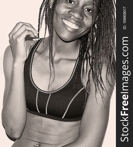 Woman in Sport Bra With Braided Hair Grayscale Photo
