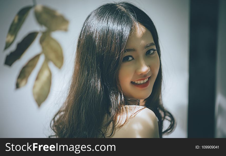 Woman with Black Long Hair Smiling