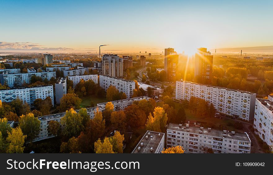 Aerial View of White Concrete Buildings during Golden Hours