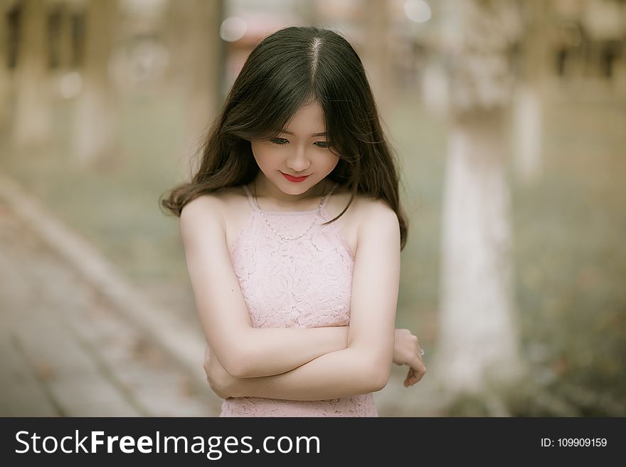 Shallow Focus Photography of Woman in Pink Dress