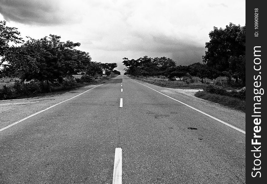 Grayscale Photography of Concrete Road during Daytime