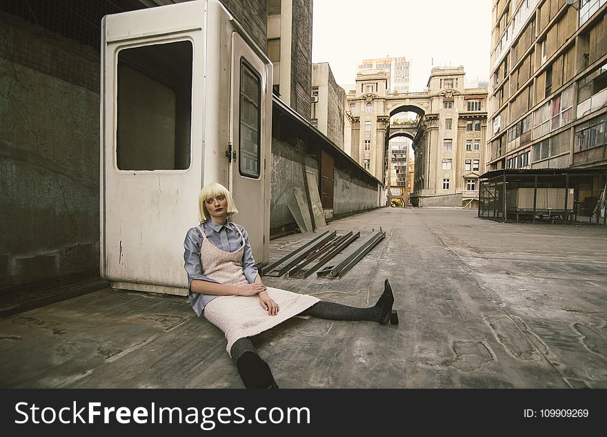 Woman Sitting On Road