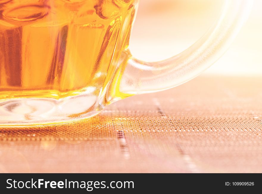 Closeup Photography of Clear Glass Beer Mug Filled With Yellow Liquid