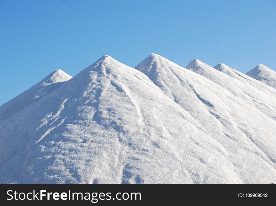 Snow Covered Mountain Under Blue Sky at Daytime