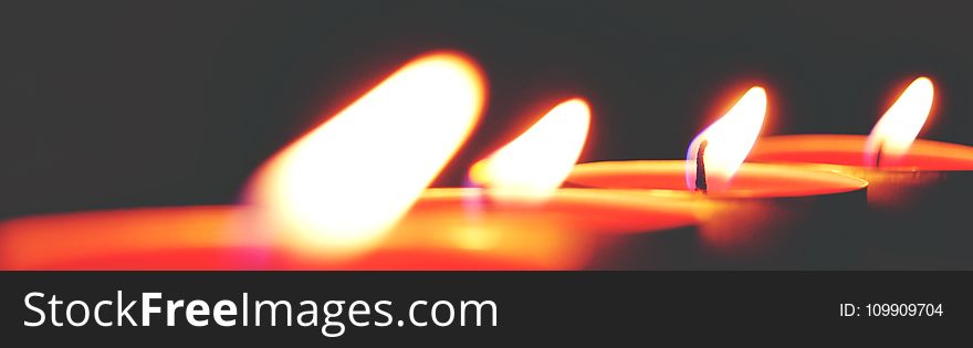 Closeup Photo of Four Tealight Candles