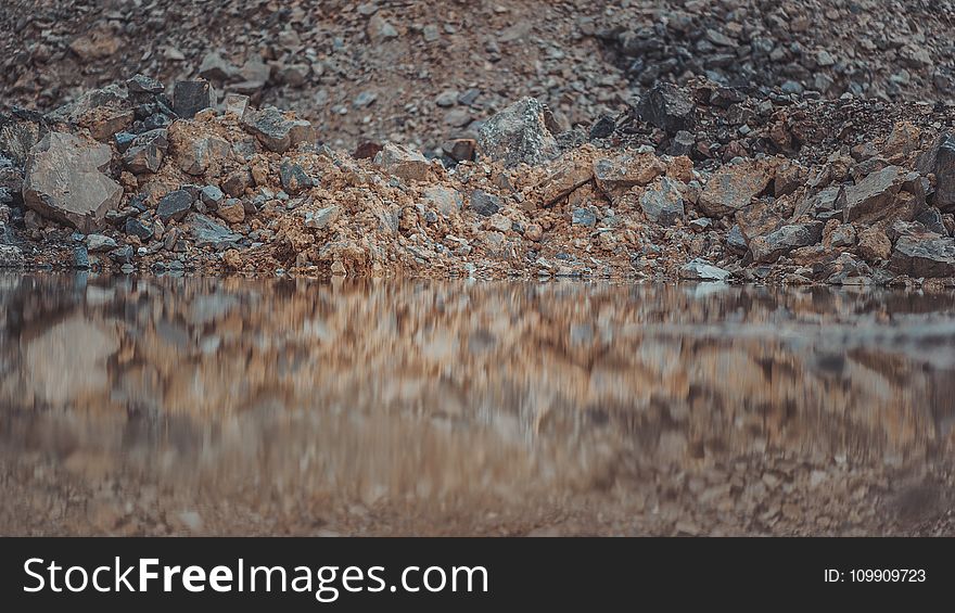 Body Of Water And Rocks