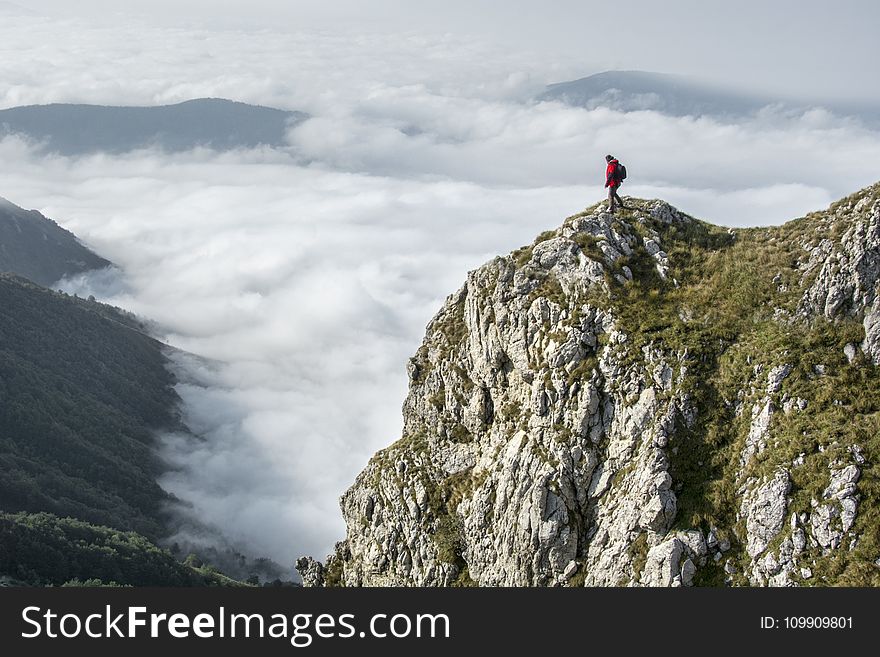 Photography of Person on Green Mountain