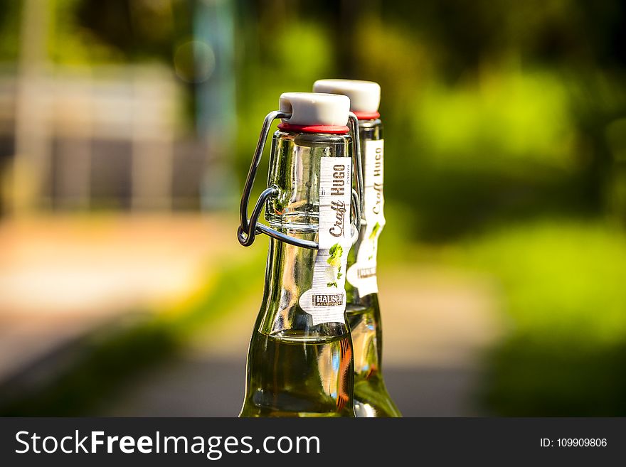 Selective Focus Photography Of Two Clear Air Tight Bottles