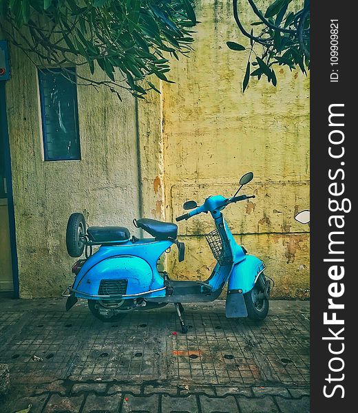 Teal Motor Scooter On Road