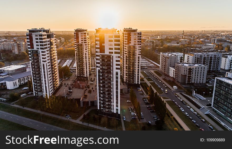 High Angle Photography of High-rise Buildings Near Road during Golden Hour