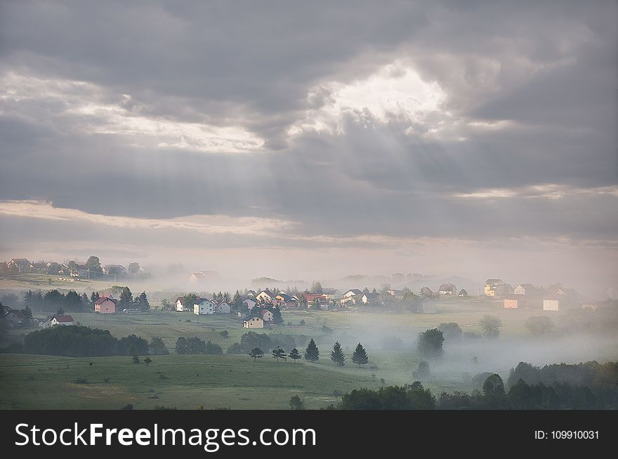 Green Grass Field during Cloudy Sky