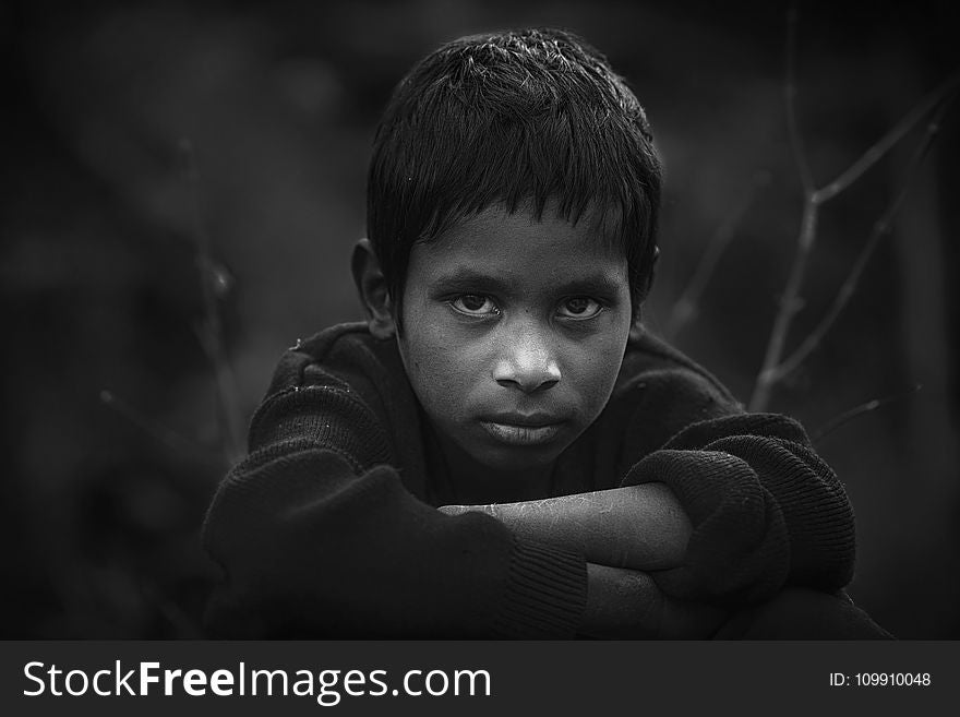 Grayscale Photo of Boy in Long-sleeved Shirt