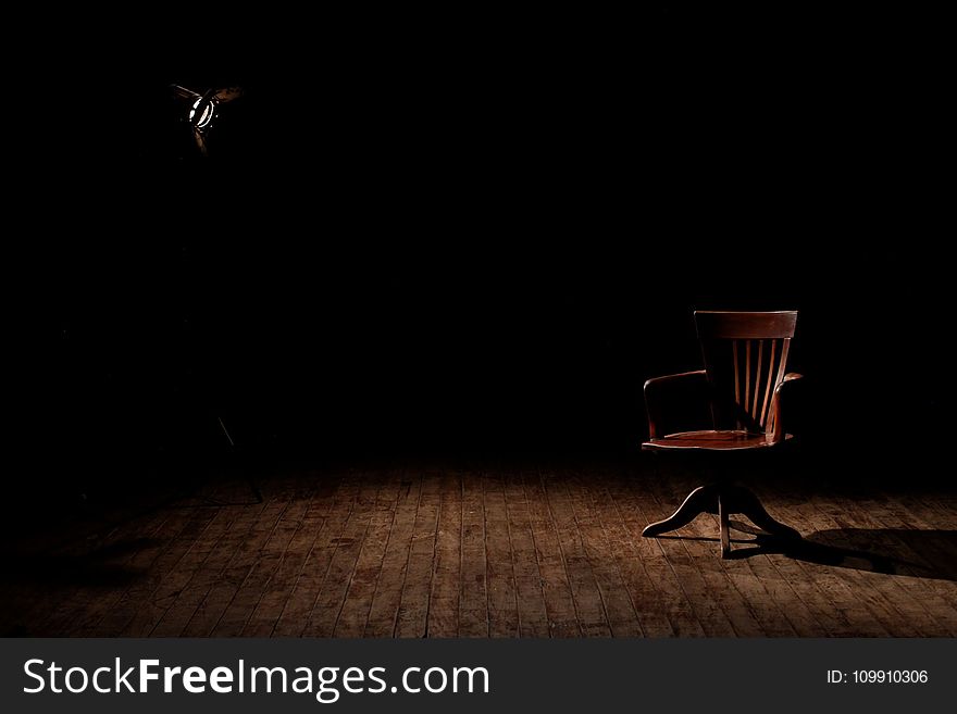 Brown Wooden Armchair on Brown Wooden Floor