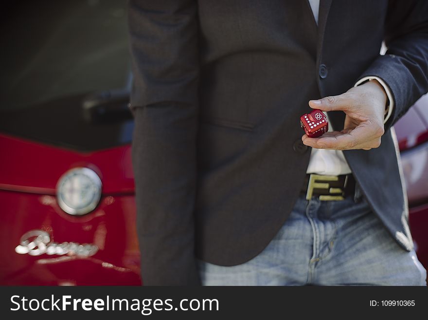 Person Holding Red Cube