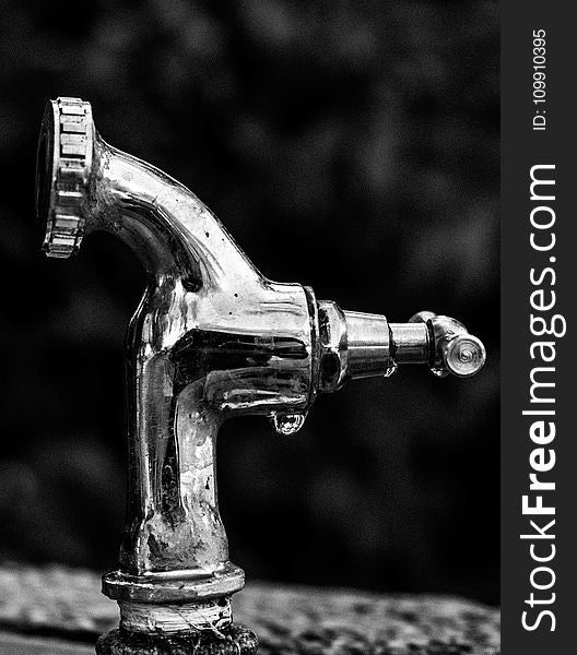 Grayscale Photo Of Stainless Steel Faucet