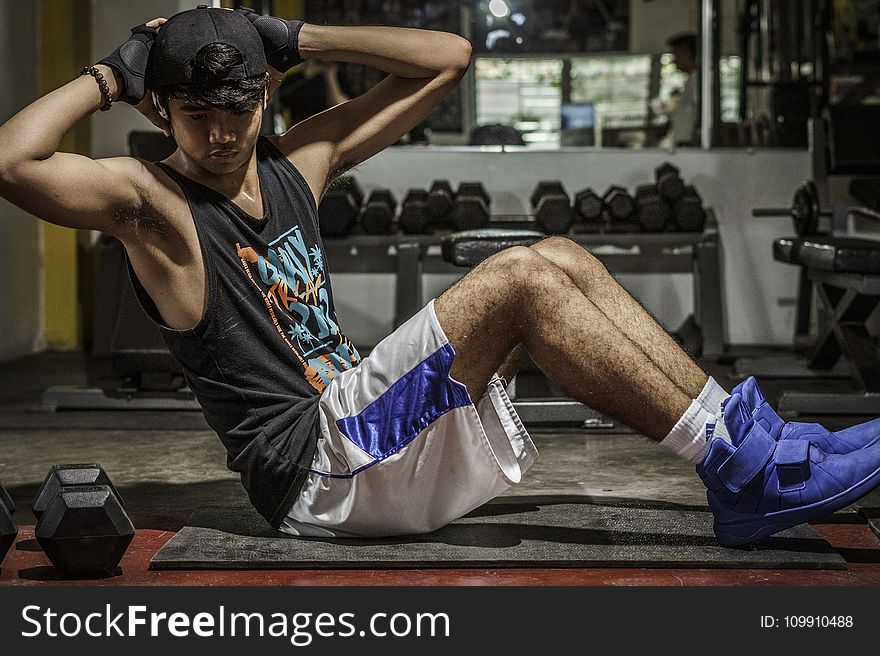 Man In Black Tank Top Inside Gym