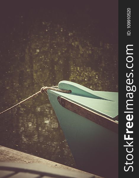 Teal Wooden Boat on Lake