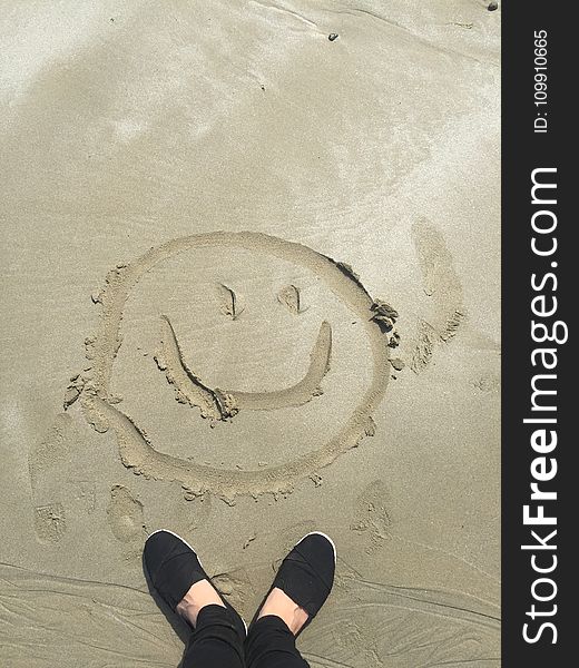 Smiley Drawing on Sand