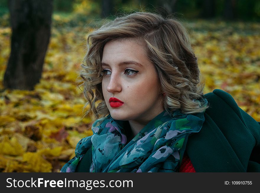 Depth Of Field Photography Of Woman With Green And White Floral Chiffon Fabric Scarf