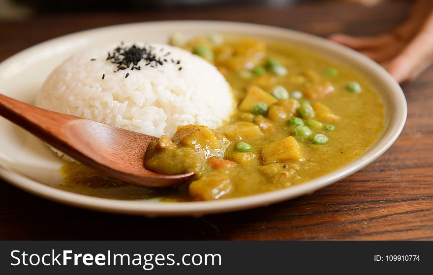 Cooked Rice And Curry Food Served On White Plate