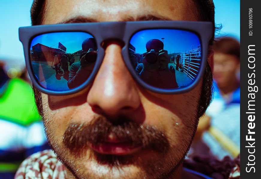 Man Wearing Black Framed Sunglasses